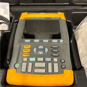 Gray and Yellow Electronic Tester